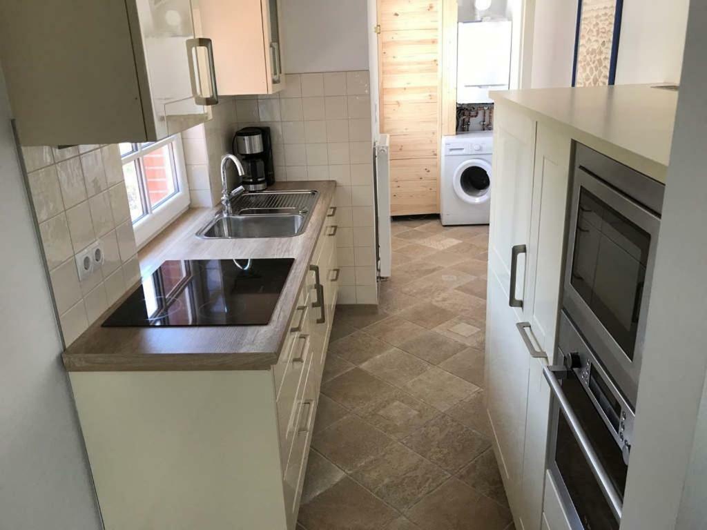 Ferienhaus Wattwurm Rysum Esterno foto