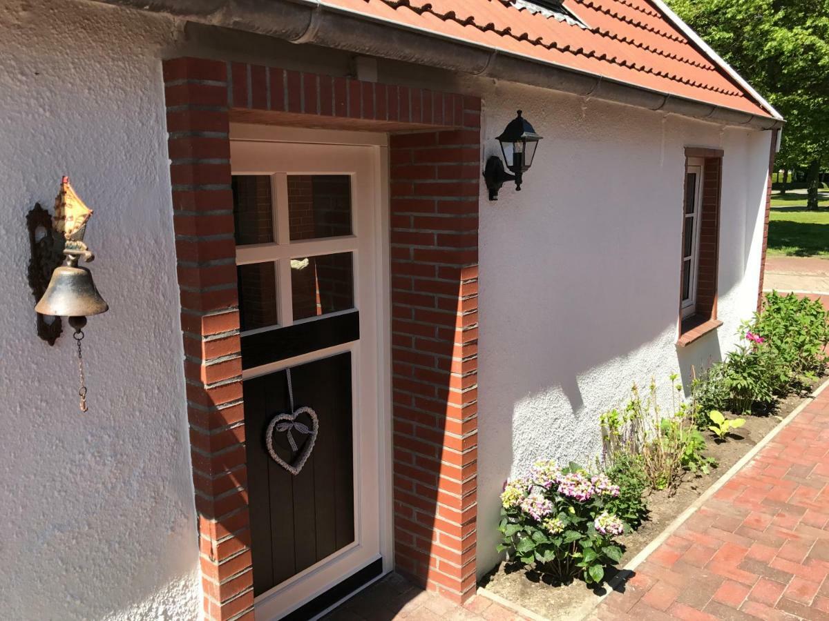 Ferienhaus Wattwurm Rysum Esterno foto
