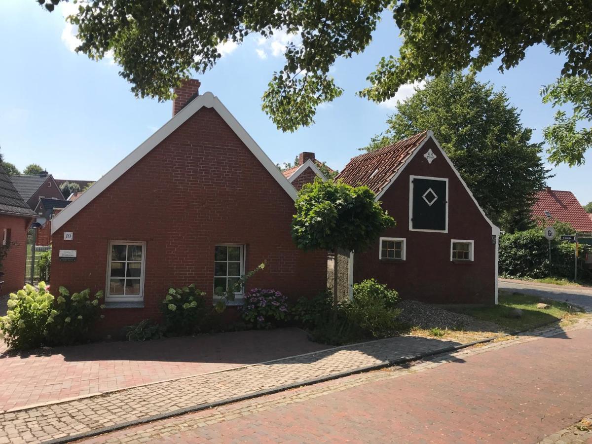 Ferienhaus Wattwurm Rysum Esterno foto